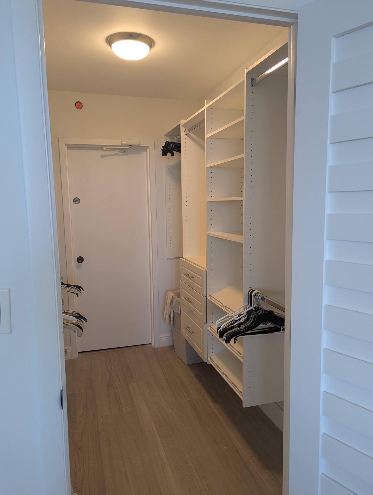2121 North Ocean Boulevard, Unit 1006E Boca Raton, FL 33431 - Photo 46 of 64 a view of walk in closet with empty racks