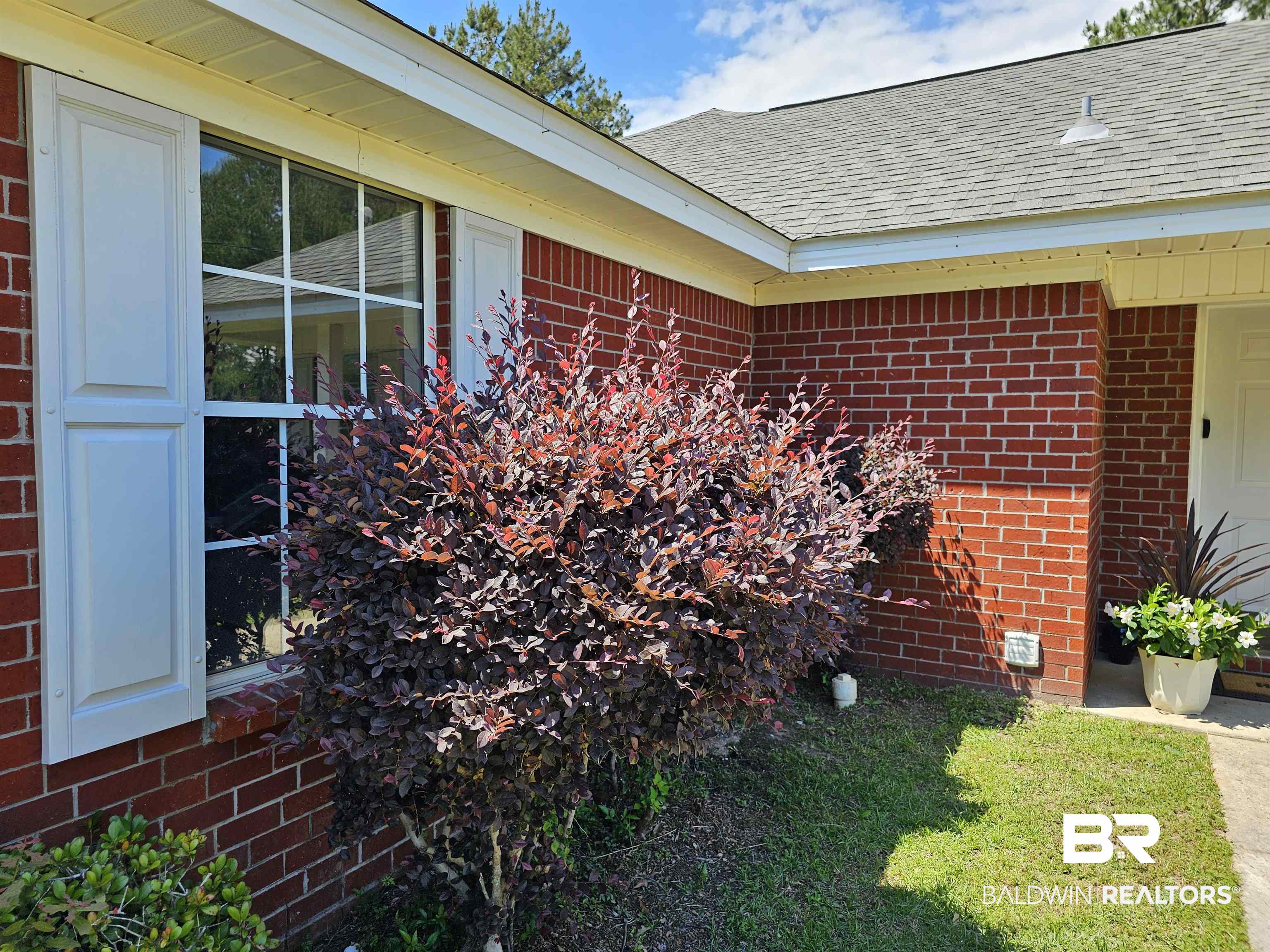 431 Hamilton Boulevard Foley, AL 36535 - Photo 28 of 30 Front of house and side garage window area.