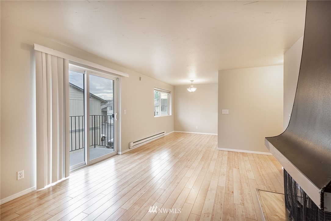 1601 Maple Lane, Unit A2 Kent, WA 98030 - Photo 11 of 27 wooden floor in an empty room with a window