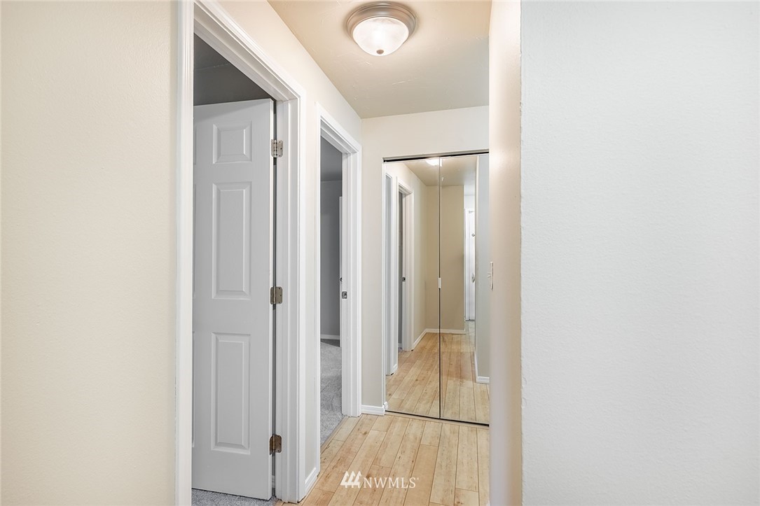 1601 Maple Lane, Unit A2 Kent, WA 98030 - Photo 19 of 27 a view of a hallway with wooden floor
