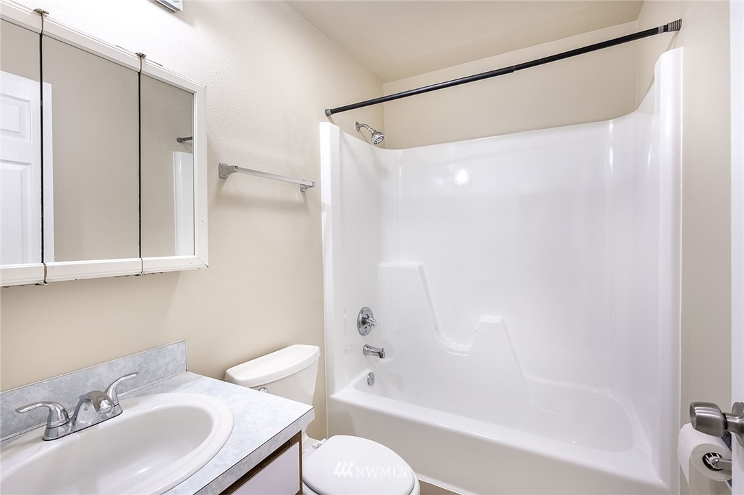 1601 Maple Lane, Unit A2 Kent, WA 98030 - Photo 22 of 27 a bathroom with a sink toilet and shower