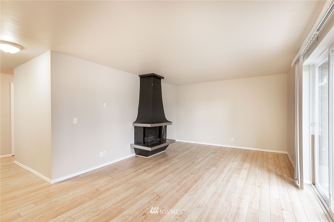 1601 Maple Lane, Unit A2 Kent, WA 98030 - Photo 8 of 27 a view of empty room with wooden floor and fan