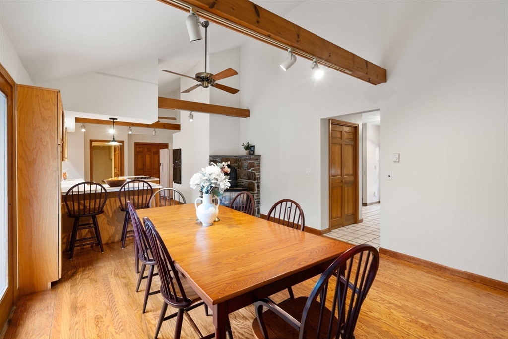 37 Finlay Road Sturbridge, MA 01518 - Photo 16 of 39 a view of a dining room and livingroom with furniture wooden floor a rug a painting and a chandelier