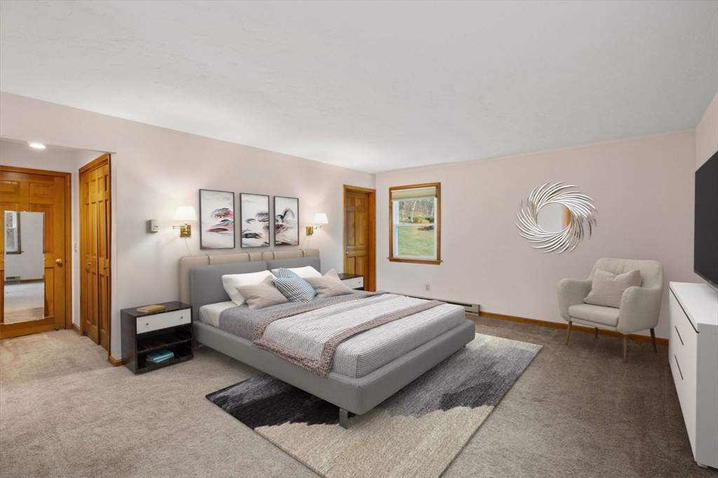 37 Finlay Road Sturbridge, MA 01518 - Photo 24 of 39 a bedroom with a bed and a couch