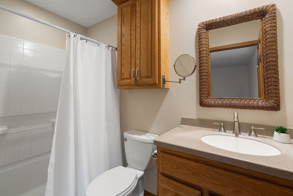 37 Finlay Road Sturbridge, MA 01518 - Photo 26 of 39 a bathroom with a sink toilet and mirror