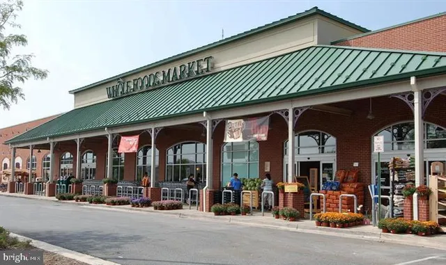 front view of a cafe with table and chairs