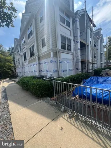 a view of a brick building with a yard