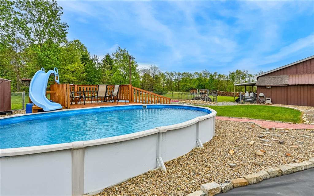 307 Hungarian Road Slippery Rock, PA 16057 - Photo 32 of 34 a view of a swimming pool with a yard