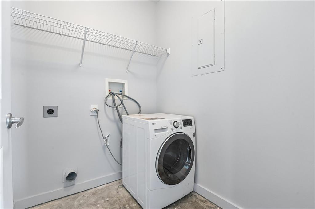 250 Pharr Road Northeast, Unit 701 Atlanta, GA 30305 - Photo 12 of 21 a utility room with dryer and washer