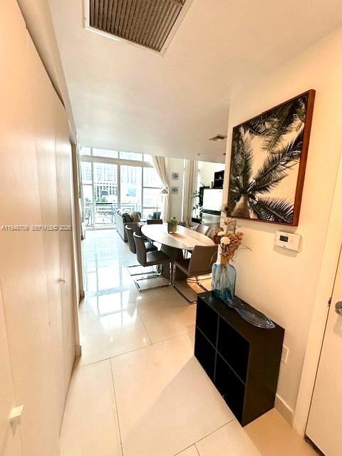 253 Northeast 2nd Street, Unit 421 Miami, FL 33132 - Photo 14 of 15 a living room with furniture and a flat screen tv