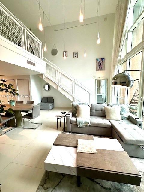 253 Northeast 2nd Street, Unit 421 Miami, FL 33132 - Photo 4 of 15 a living room with furniture and a table