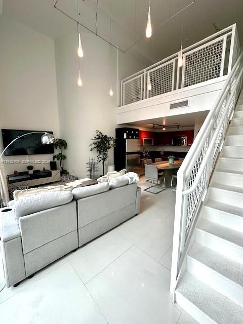 253 Northeast 2nd Street, Unit 421 Miami, FL 33132 - Photo 6 of 15 a living room with furniture and a fireplace