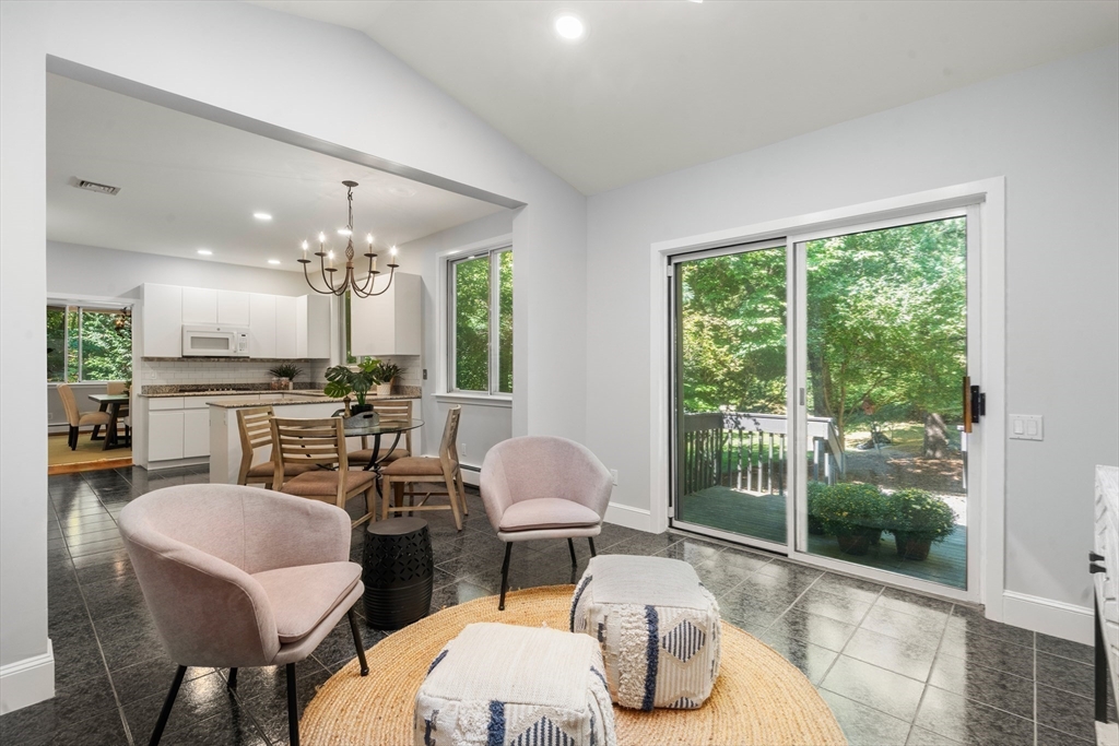 214 Allandale Road, Unit B Boston, MA 02467 - Photo 12 of 35 a living room with furniture and a large window