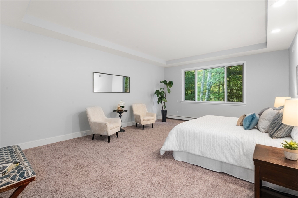 214 Allandale Road, Unit B Boston, MA 02467 - Photo 14 of 35 a bedroom with bed and a couch