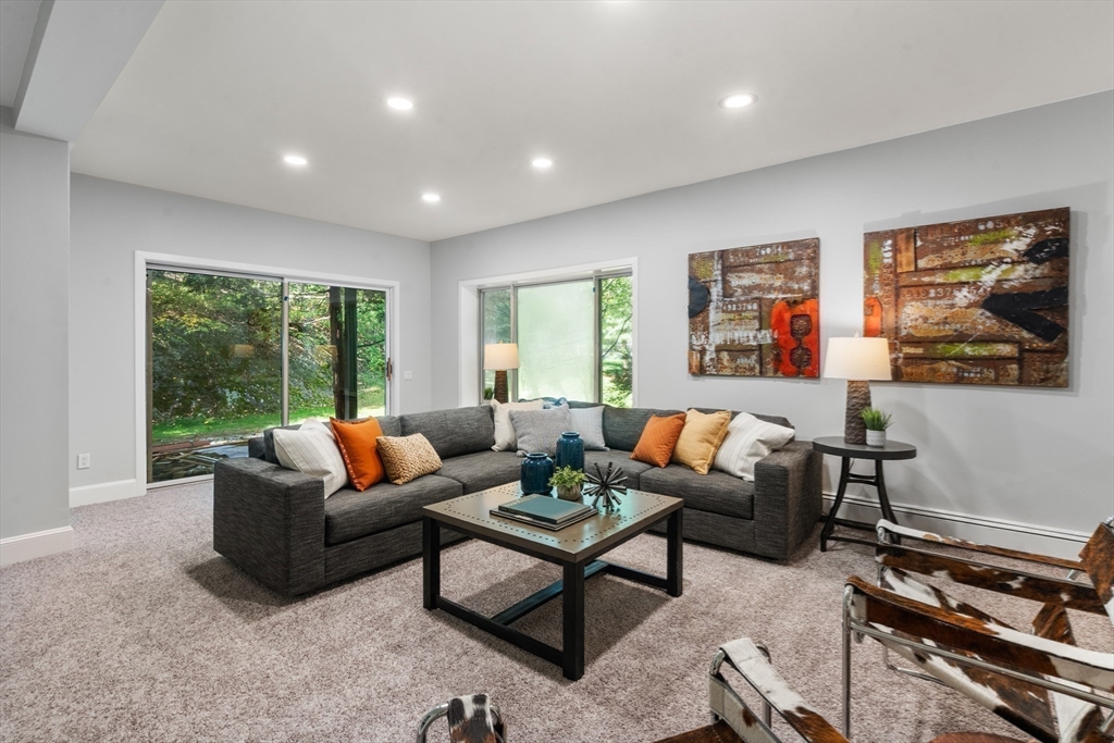 214 Allandale Road, Unit B Boston, MA 02467 - Photo 20 of 35 a living room with furniture and a large window