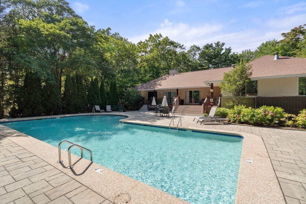 214 Allandale Road, Unit B Boston, MA 02467 - Photo 32 of 35 a view of swimming pool and lounge chair