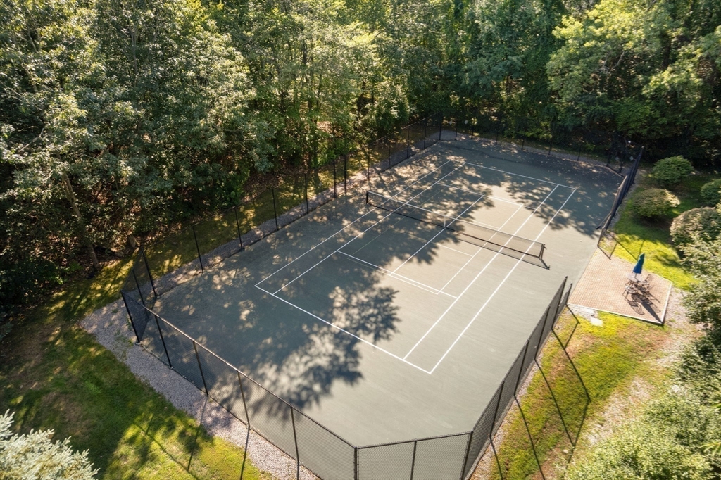214 Allandale Road, Unit B Boston, MA 02467 - Photo 33 of 35 a backyard of a house with table and chairs