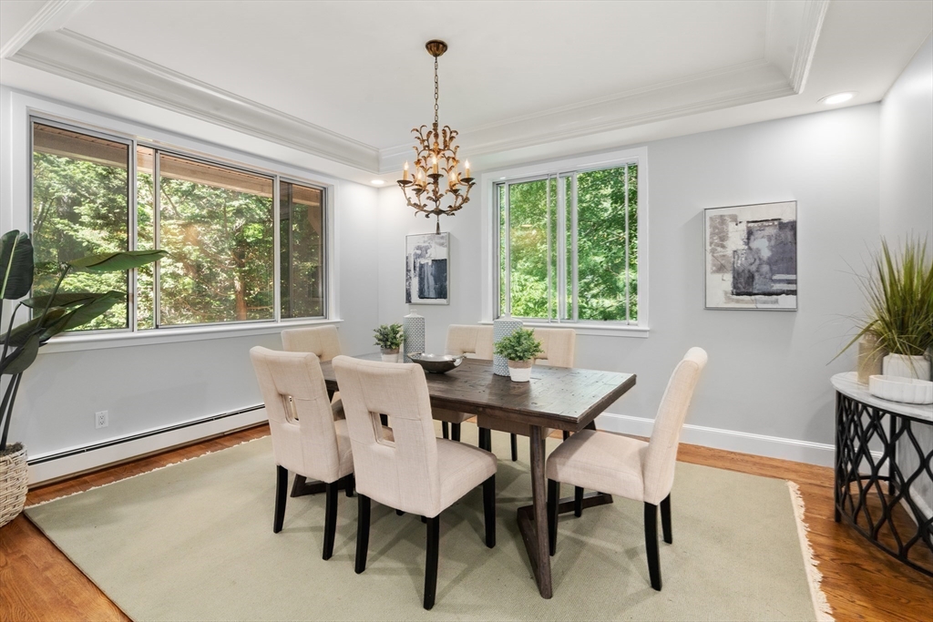 214 Allandale Road, Unit B Boston, MA 02467 - Photo 8 of 35 a view of a dining room with furniture window and wooden floor
