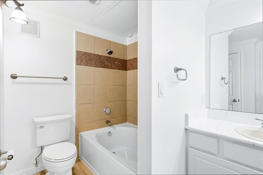 2601 Preston Road, Unit 1201 Plano, TX 75093 - Photo 19 of 28 a bathroom with a sink a toilet and shower