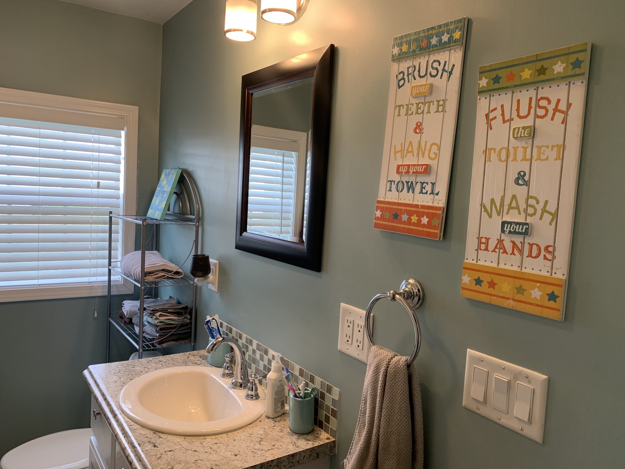 62 Asa Smith Road Ardmore, TN 38449 - Photo 14 of 24 a bathroom with a sink a toilet and mirror
