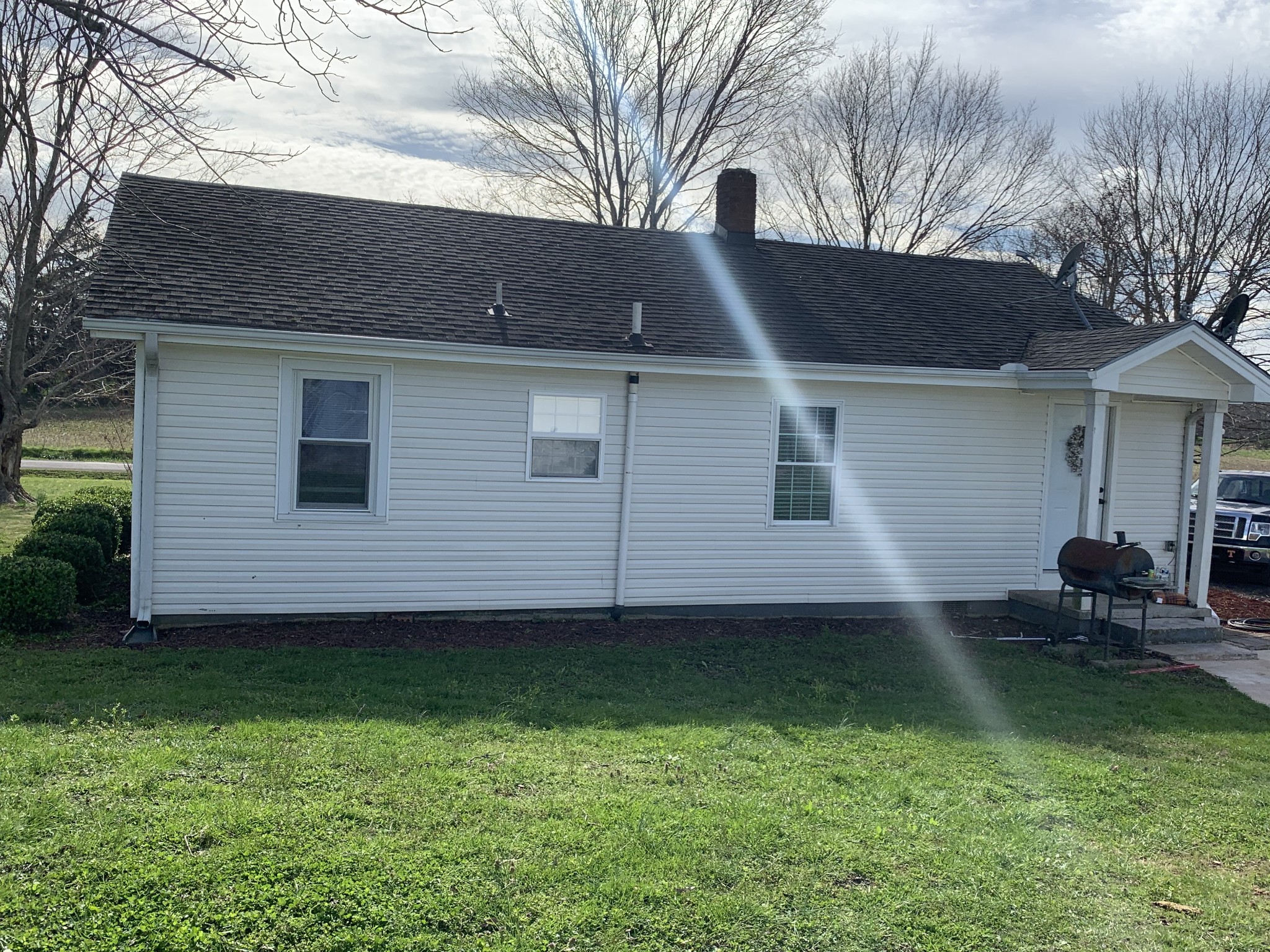 62 Asa Smith Road Ardmore, TN 38449 - Photo 23 of 24 a backyard of a house with seating space