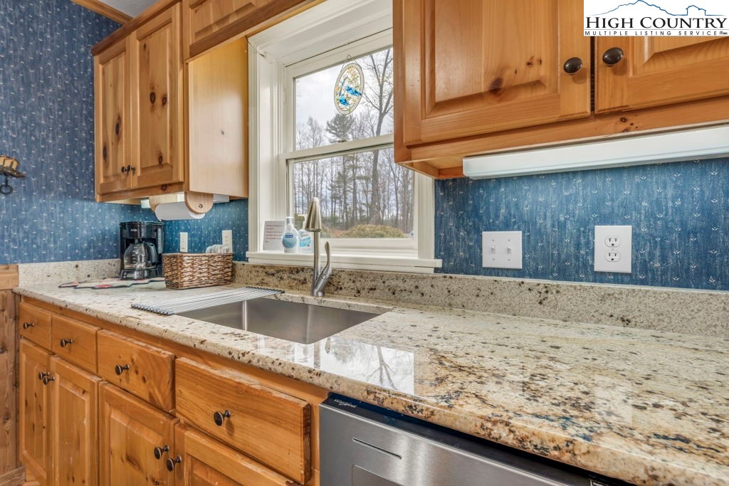 883 Wagon Ridge Road Ferguson, NC 28624 - Photo 12 of 50 a kitchen with sink and window