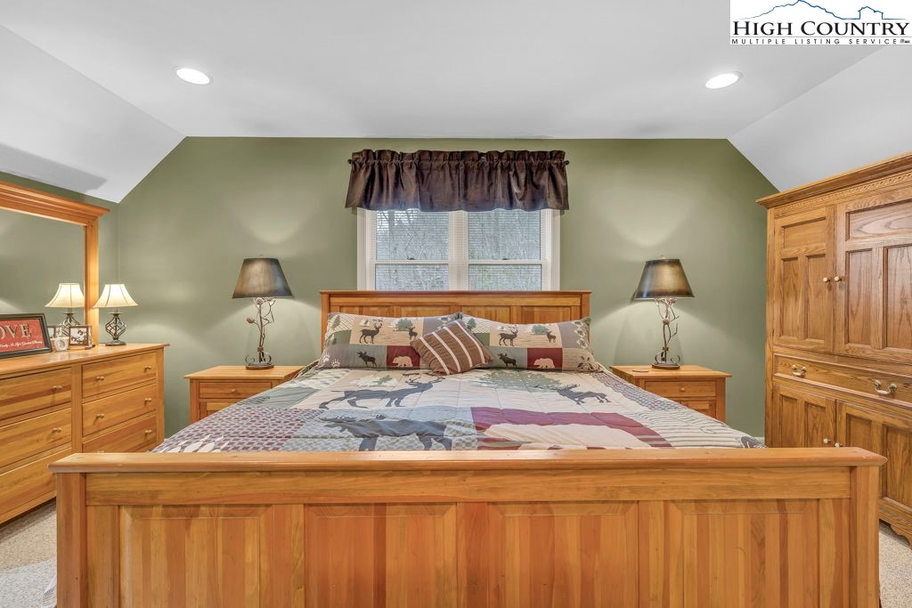 883 Wagon Ridge Road Ferguson, NC 28624 - Photo 24 of 50 a bedroom with a bed and a dresser