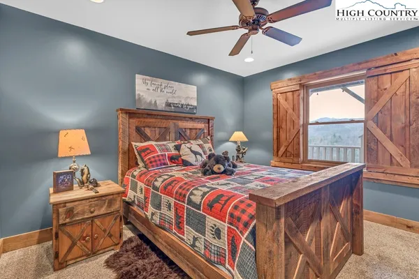 a bedroom with a bed and a table in it