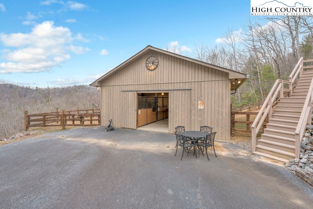 883 Wagon Ridge Road Ferguson, NC 28624 - Photo 41 of 50 a view of a terrace with chairs