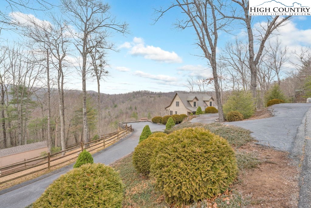 883 Wagon Ridge Road Ferguson, NC 28624 - Photo 46 of 50 a view of a backyard with large trees