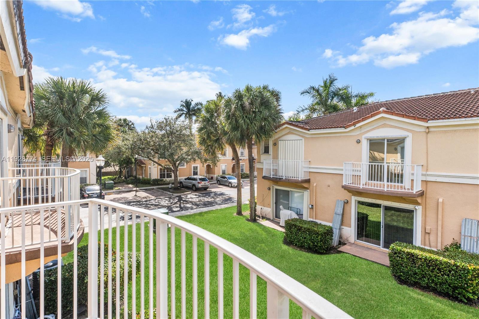 3168 Southwest 129th Way, Unit 151 Miramar, FL 33027 - Photo 15 of 21 a front view of a house with a garden