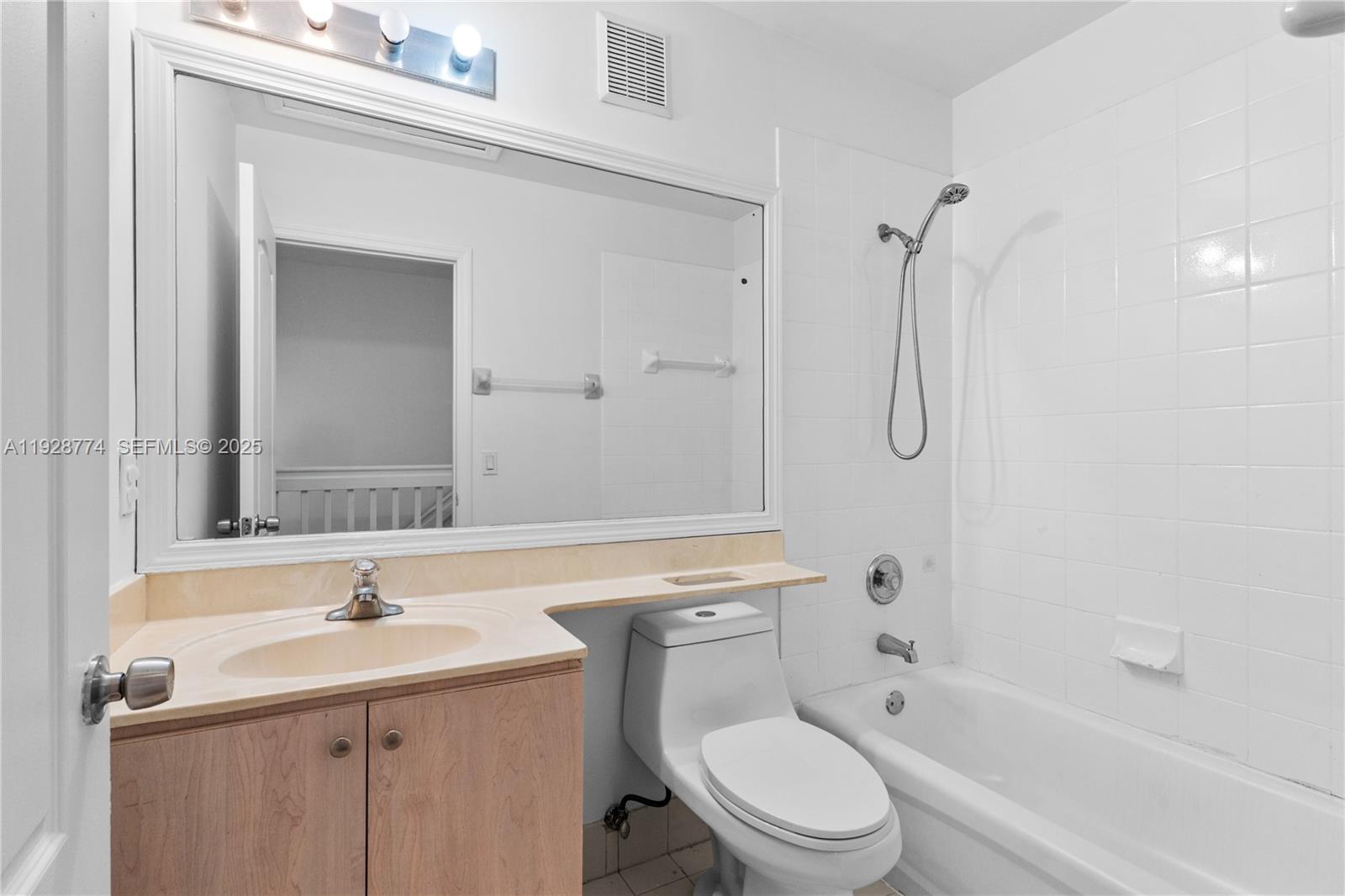 3168 Southwest 129th Way, Unit 151 Miramar, FL 33027 - Photo 17 of 21 a bathroom with a sink a toilet and shower