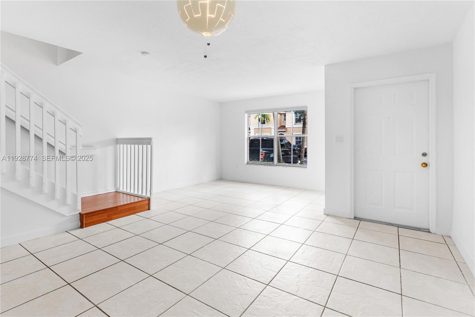 3168 Southwest 129th Way, Unit 151 Miramar, FL 33027 - Photo 4 of 21 a view of an empty room and window