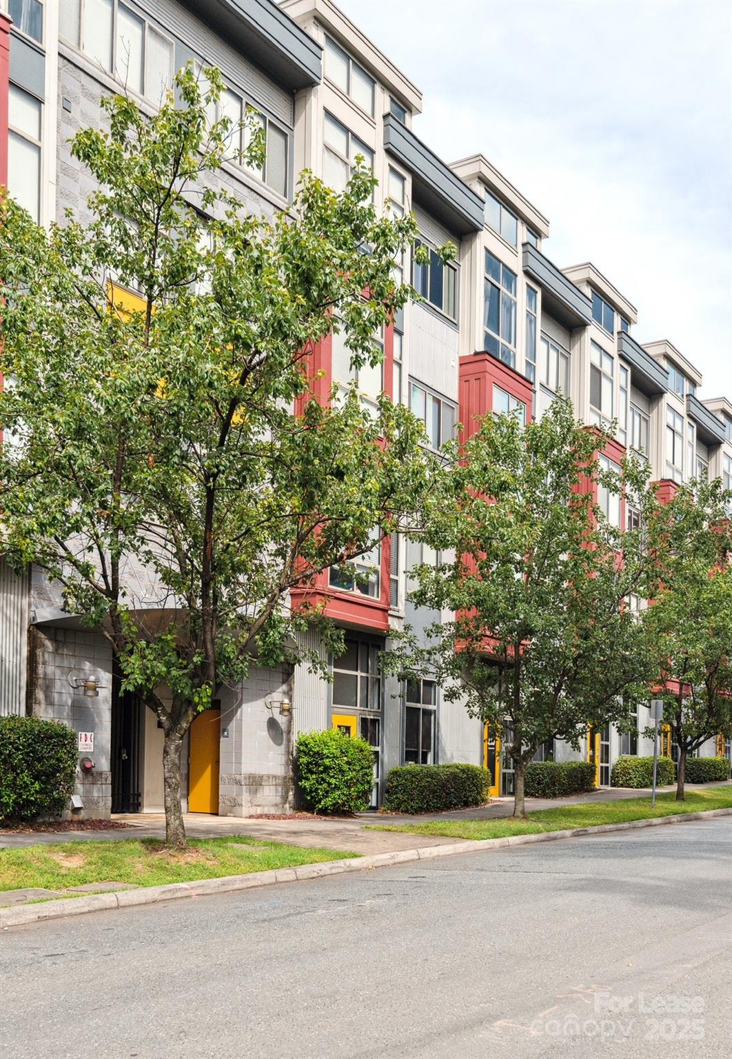 a front view of a building with traffic signal lights