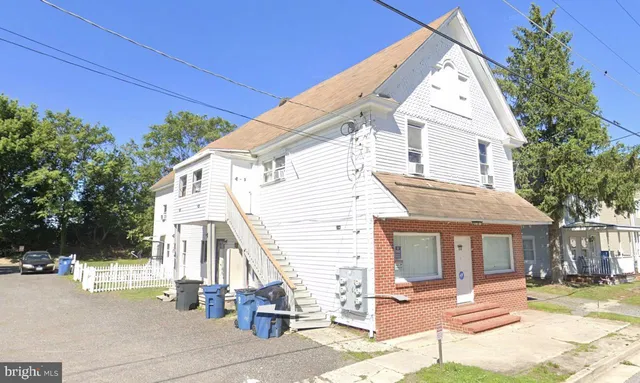 a view of a white house with a large windows