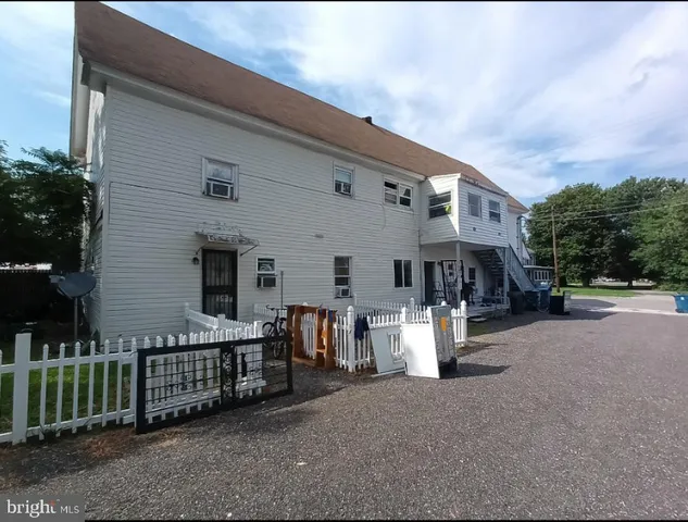 a view of a patio with furniture and floor to ceiling window