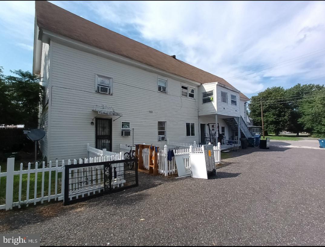 310 Main Street Marydel, MD 21649 - Photo 7 of 10 a view of a patio with furniture and floor to ceiling window
