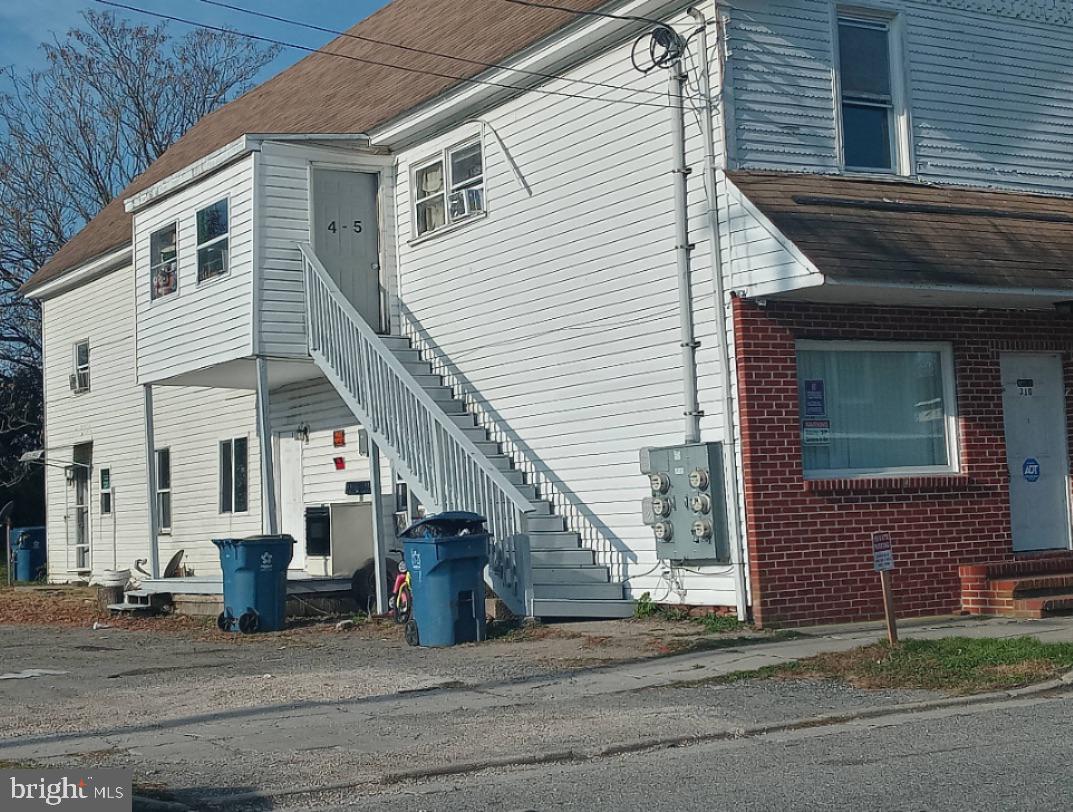 310 Main Street Marydel, MD 21649 - Photo 8 of 10 a view of a house with a patio