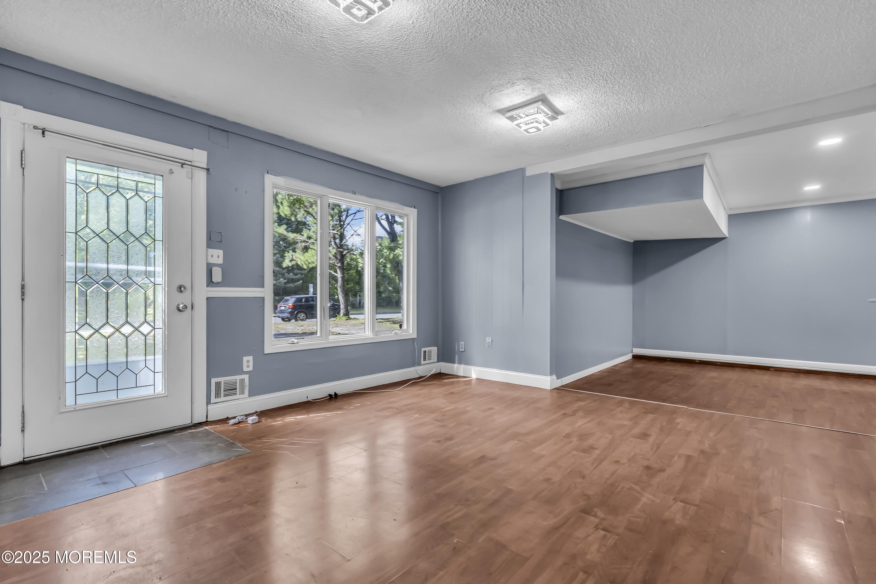 32 1st Street Barnegat, NJ 08005 - Photo 3 of 16 a view of an empty room with a window