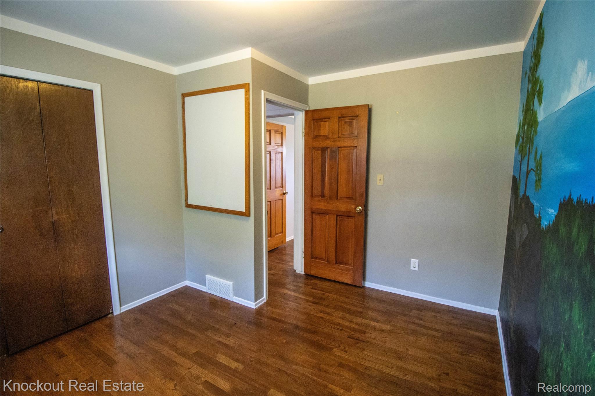 5796 East Burt Road Birch Run, MI 48415 - Photo 24 of 41 Wood-finish flooring with crown molding and recessed lighting