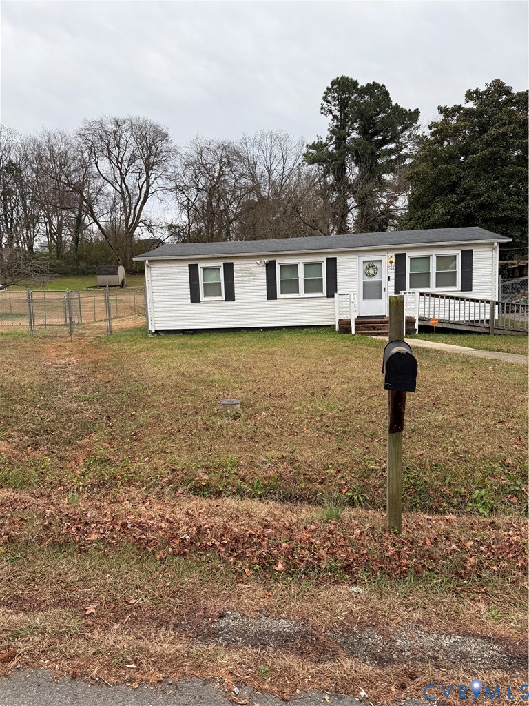 501 West 3rd Street Chase City, VA 23924 - Photo 2 of 14 a front view of a house with garden