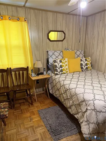 a bedroom with a bed and a table