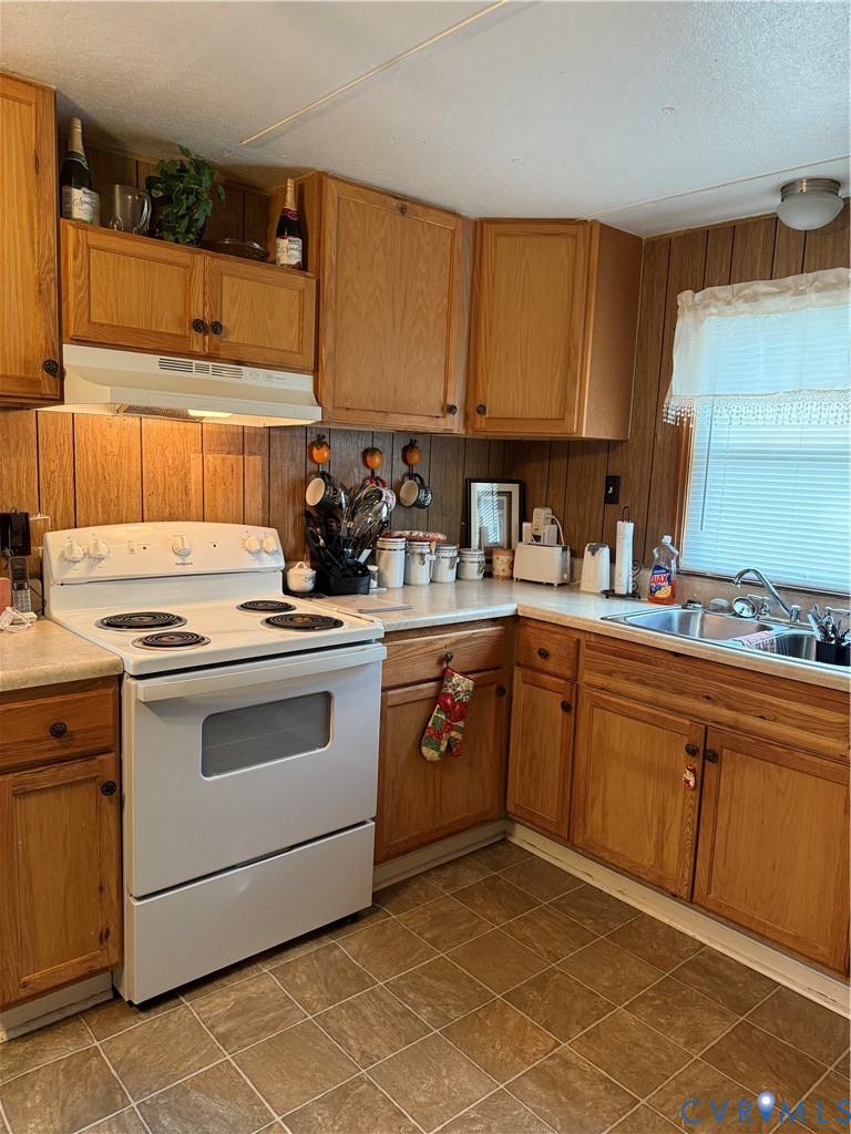 501 West 3rd Street Chase City, VA 23924 - Photo 10 of 14 a kitchen with a sink stove and cabinets