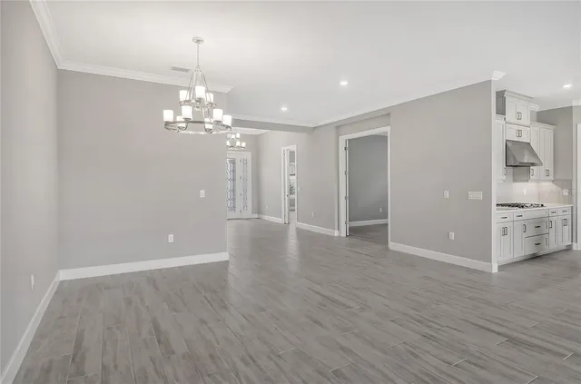 a front view of a house with swimming pool garden and patio