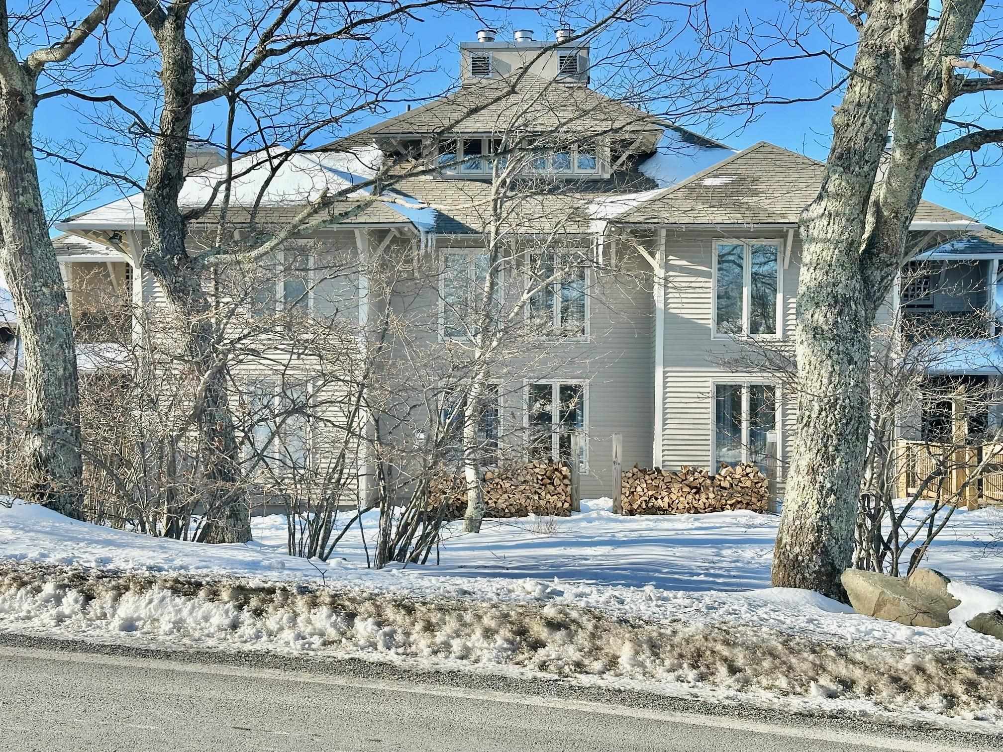 a view of a building with a yard