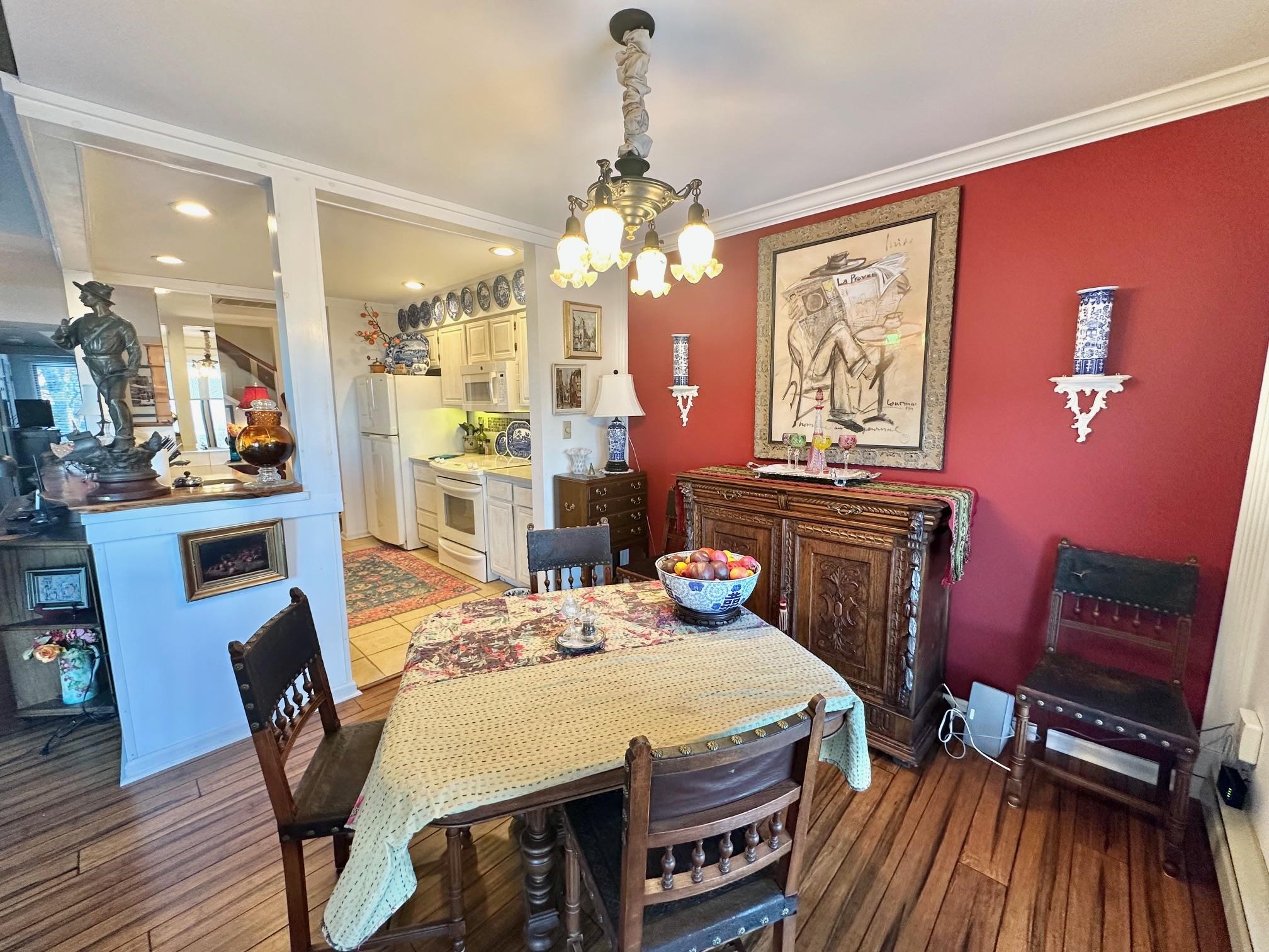 3206 North Ridge Wintergreen, VA 22967 - Photo 11 of 41 a view of a dining room with furniture a chandelier and wooden floor