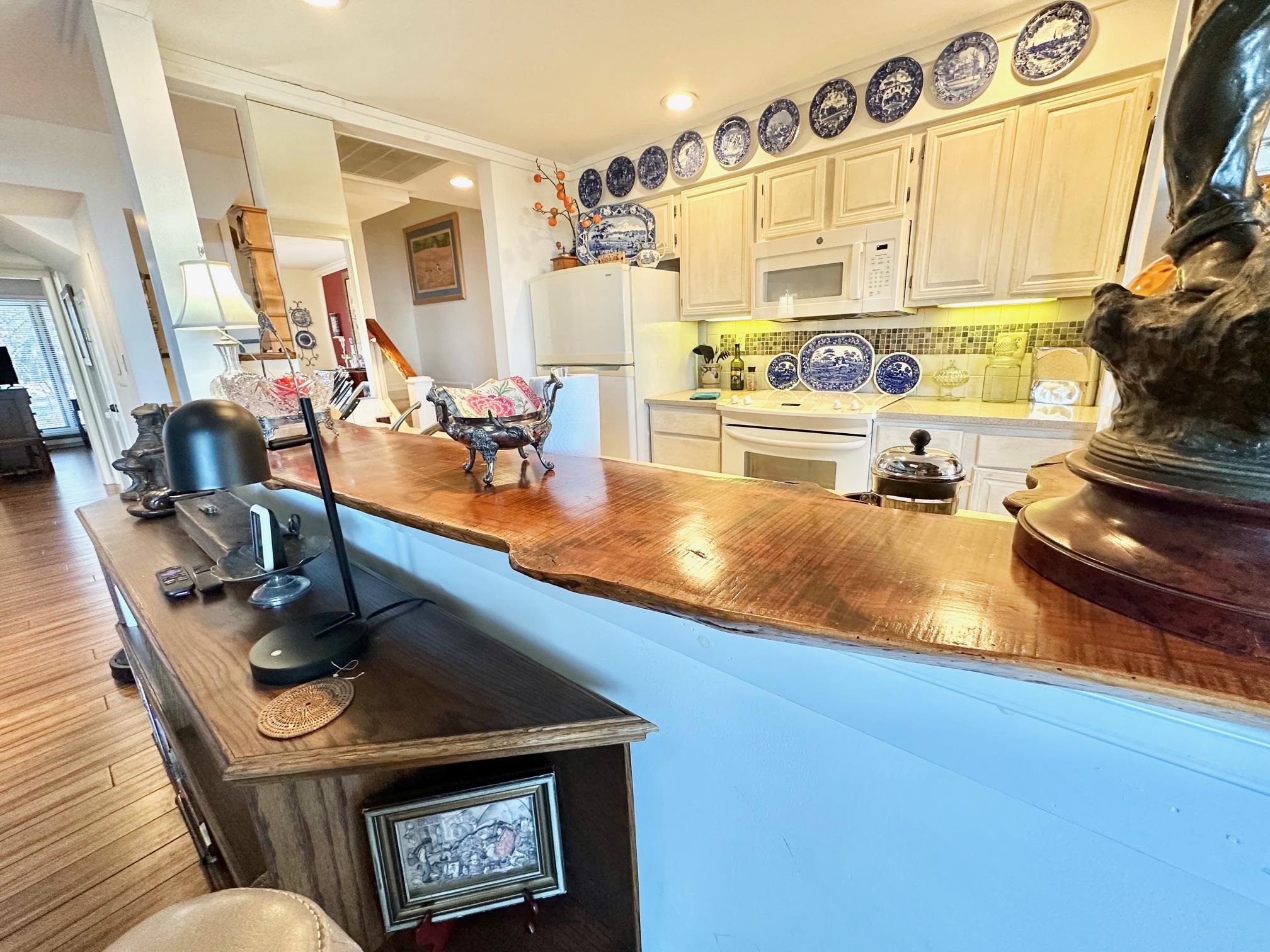 3206 North Ridge Wintergreen, VA 22967 - Photo 14 of 41 a kitchen with stainless steel appliances granite countertop a sink dishwasher and cabinets with wooden floor