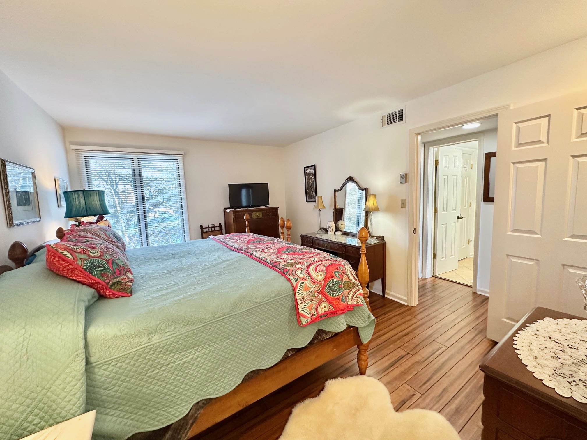 3206 North Ridge Wintergreen, VA 22967 - Photo 22 of 41 a bedroom with a bed and wooden floor