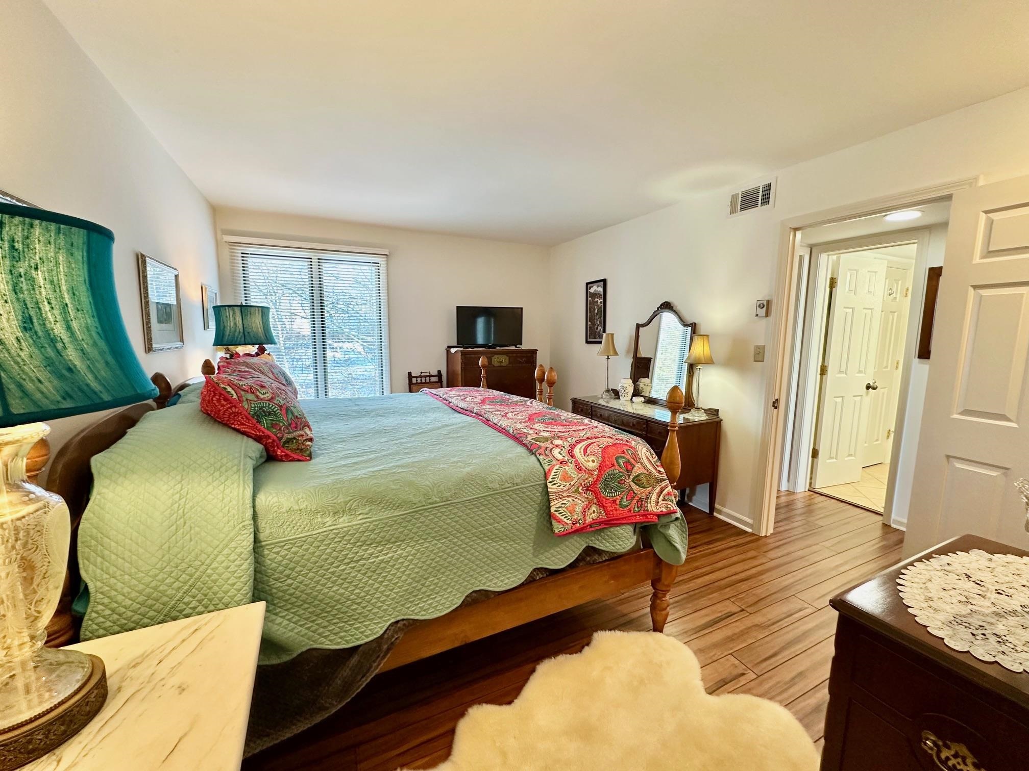 3206 North Ridge Wintergreen, VA 22967 - Photo 23 of 41 a bedroom with a bed and wooden floor