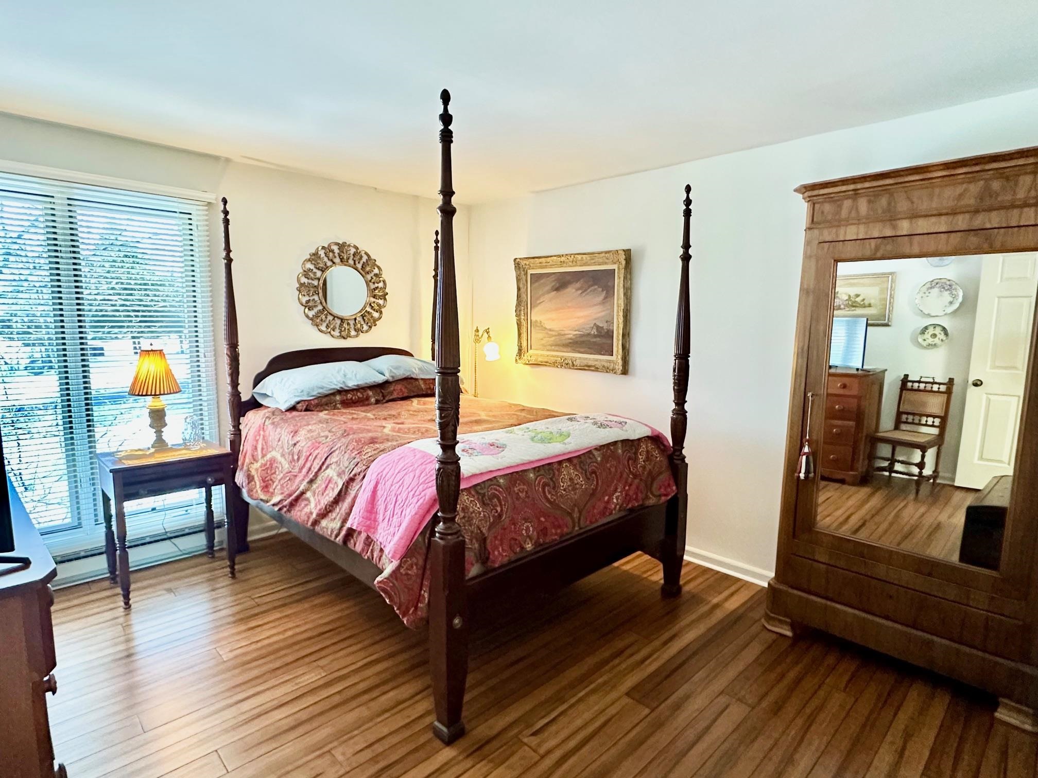 3206 North Ridge Wintergreen, VA 22967 - Photo 27 of 41 a bedroom with a bed and wooden floor